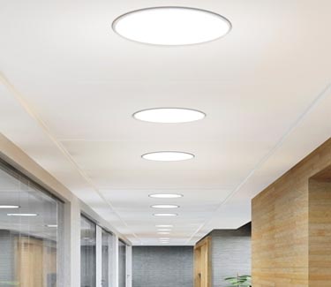 Several commercial 21 inch NLES tubular skylights office hallway thumb