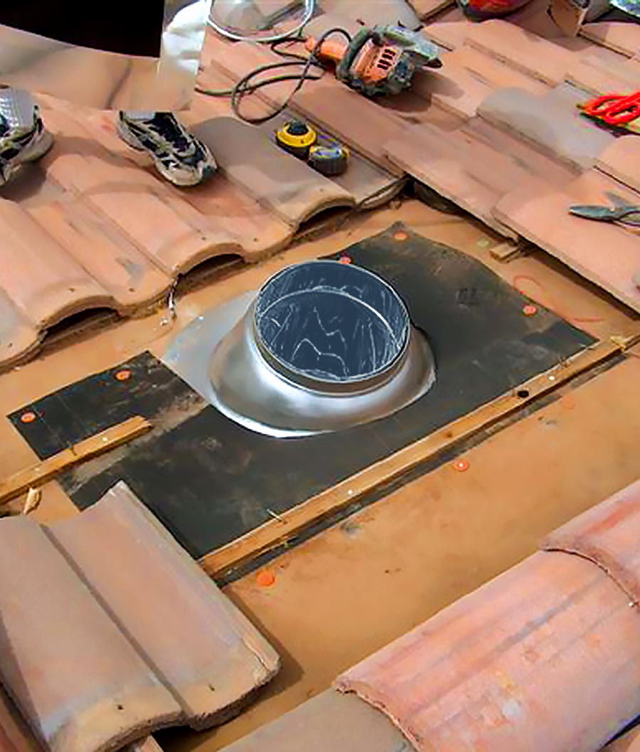 Natural Light tubular skylight installation on tile roof