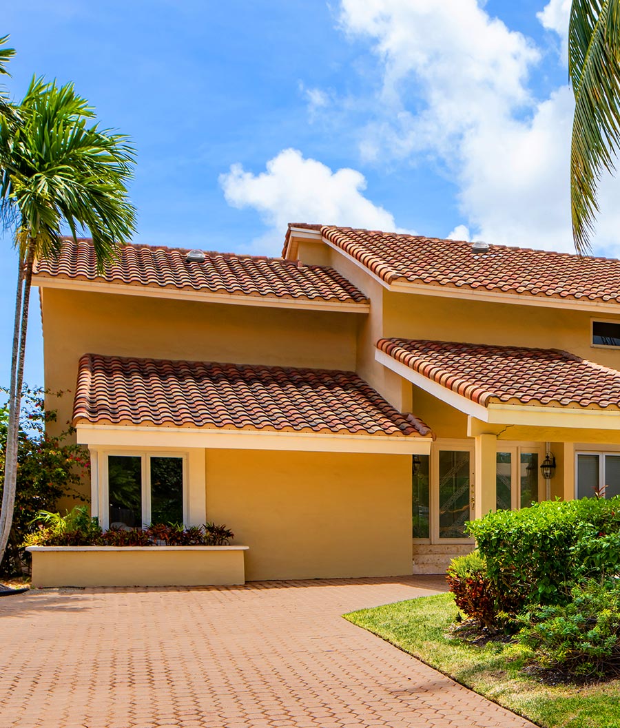 Two Natural Light tubular skylights on tile roof home